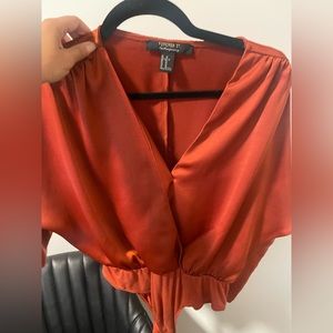 Burnt orange silk body suit blouse